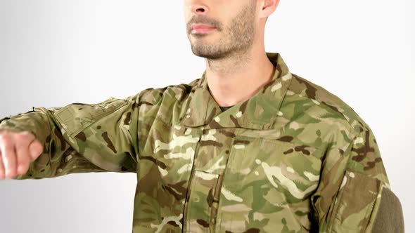 Soldier saluting on white background