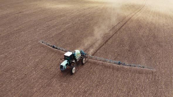 Farm machine sprayer tractor. Aerial view of modern farm machine sprayer on field