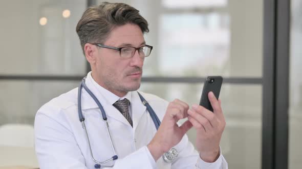 Portrait of Doctor using Smartphone