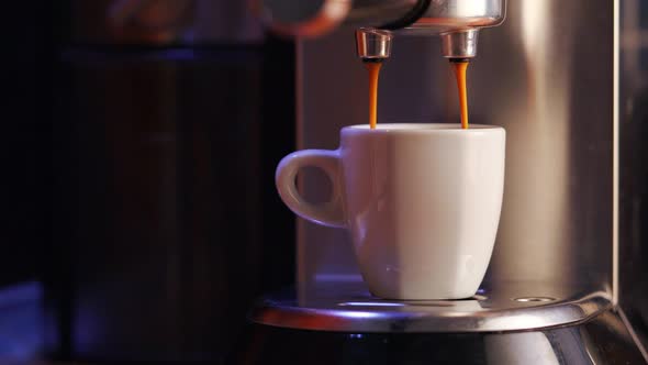 Close up shot of brewing fresh italian espresso on semi automatic espresso machine with porta filter