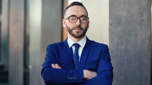 Portrait of Stylish Business Male Standing with Crossed Hands