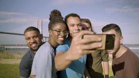 Happy Friends Running To Smartphone To Take Selfie