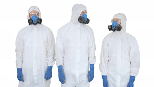 Team of Scientists or Doctors in Protective Suits Ready for Work Crossing Hands on White Background