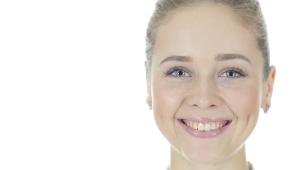 Woman Turning Face Toward Camera, Smiling