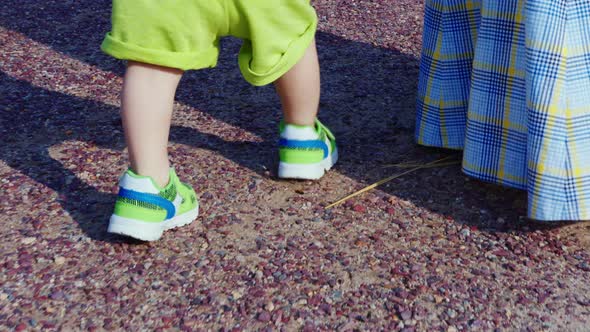 Lady in Sundress Going with Little Boy