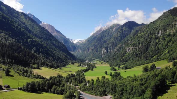 Idyllic Scene Of Valley And Tranquil Lake Klammsee In Kaprun, Austria - aerial shot