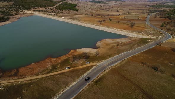 Aerial View Of Car Driving The Road