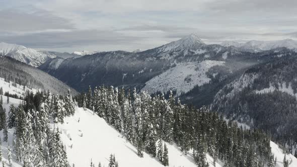 Drone Arc Aerial View Of Snowy Winter Mountains North Cascades Stevens Pass Washington