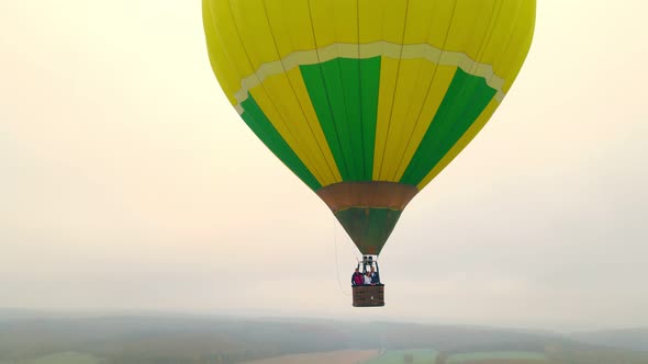 Balloon Flying Over the Autumn Forest in Thick Fog and Cloudy Weather View From Above