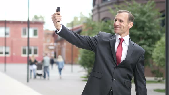 Businessman Taking Selfie