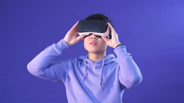 Korean Young Man Surprised By Something in Virtual Reality