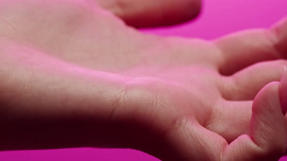 Hand Skin in Pink Neon Light Female Human Body Part and Ultraviolet Arm Surface Macro Shooting