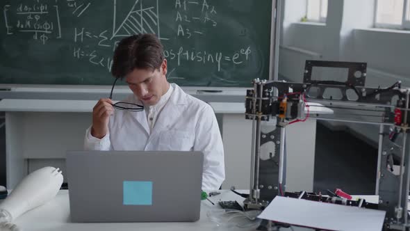 Teacher Sits on the Chair and Thinks About the Science