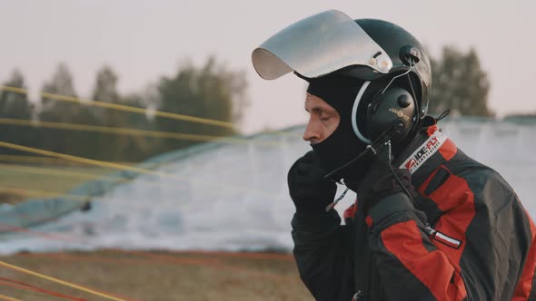 Instructor Adjusting His Safety Gear During Prestarting Procedure