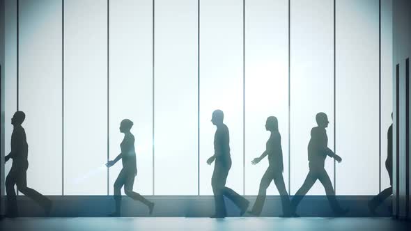 Silhouettes of a crowd of backlighted people walking in bright spacious lobby.