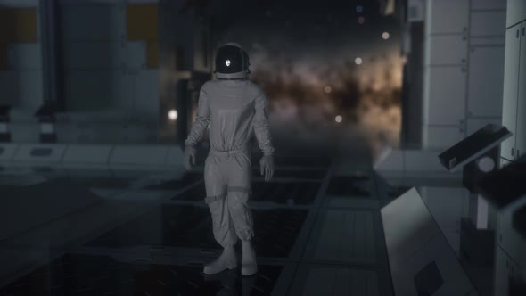 Alone Astronaut in Futuristic Spaceship Room