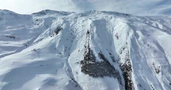 Aerial view of beautiful snowy mountains in Gudauri, Georgia