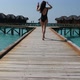 Girl walking on a wood bridge in Maldives - VideoHive Item for Sale