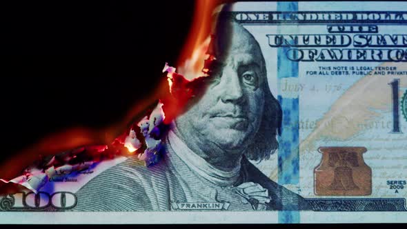 Burning American Hundred Dollar Banknote on Black Background