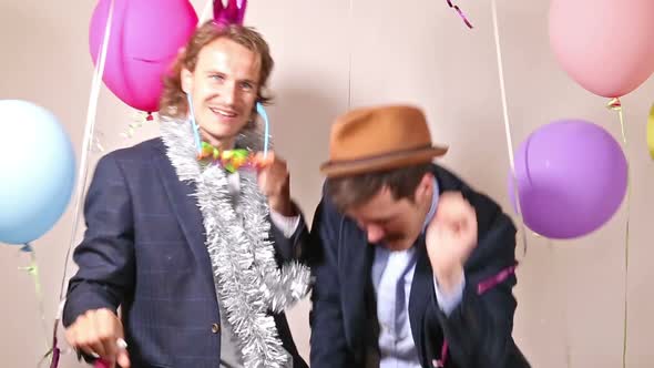 Party guys dancing in photo booth