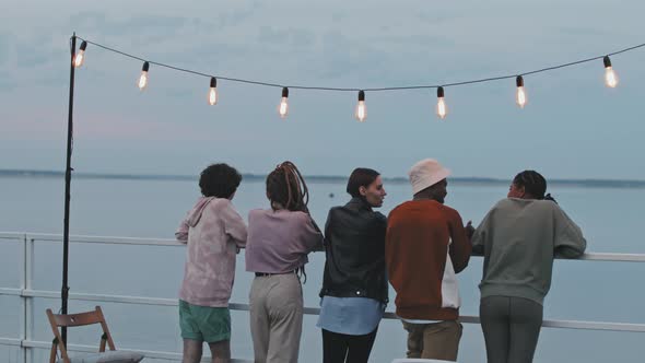 Multiracial Friends Enjoying Lake View