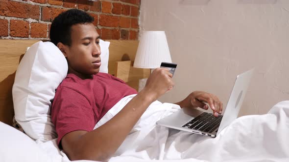 Online Payment Failure, Upset African Man in Bed Trying to Shop Online