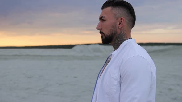 Brutal Man Walking on Beach