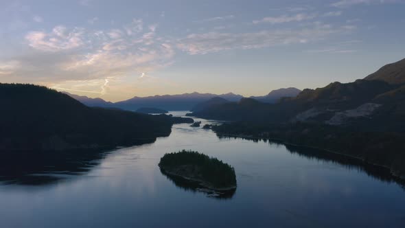 Misty river and mountains of Canada during sunset - aerial