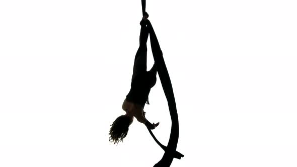 Woman Dancer on Aerial Silk, Aerial Contortion, Aerial Ribbons, Aerial Fabric in Posing Exercise