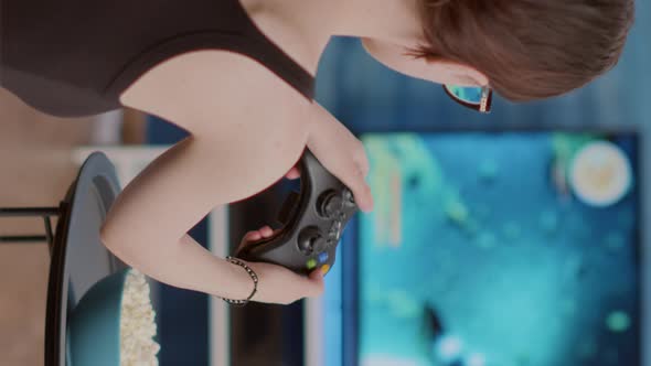 Closeup of Woman Holding Controller Celebrating Victory in Online First Person Shooter Game