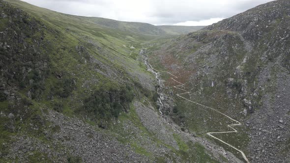 Hiking Trail And Stream Along The Glendalough Valley In County Wicklow, Ireland - aerial drone