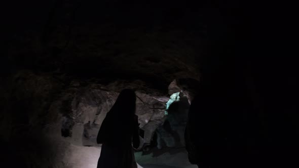 Woman Tourist Explores a Cave Dungeon Cave Dungeon Dark Tunnel