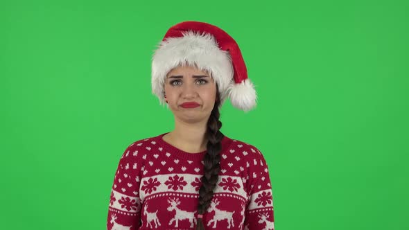 Portrait of Sweety Girl in Santa Claus Hat Is Frustrated Saying Wow. Green Screen