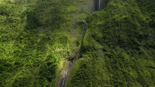 Aerial view of a waterfall on the side of a big mountain on the Reunion Island. "La cascade Blanche,