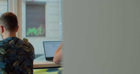 Two Web Developers Working at the Computer Inthe Modern Office.