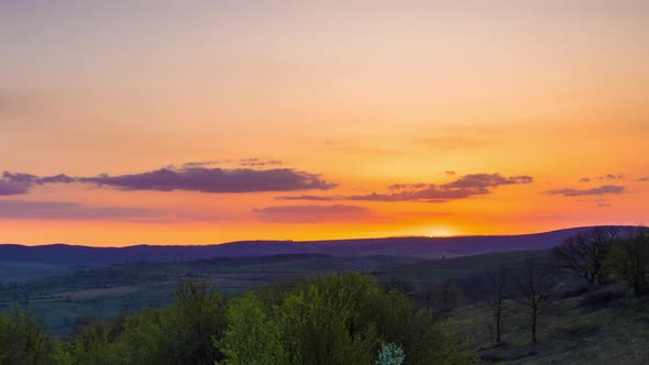 Field with Plants in the Valley Against the Backdrop of the Sunset Sky in Bulgaria