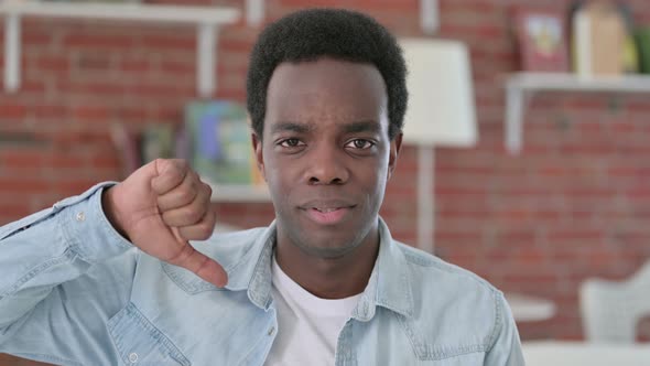 African Man Showing Thumbs Down