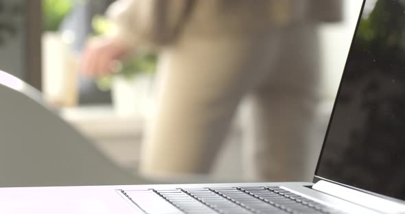 Young Woman Dances in her Home Office