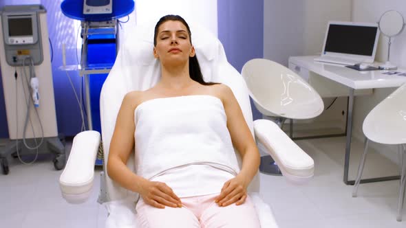 Female patient relaxing on surgical chair