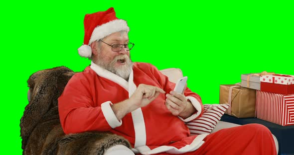 Santa claus using mobile phone 4k