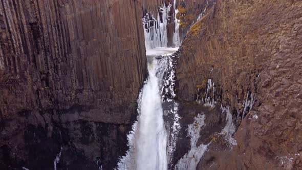 View at Litlanesfoss waterfall and vertical basalt columns are around it, Fljotsdalshreppur municipa