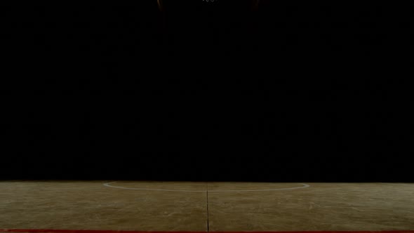 Male basketball player playing in the court