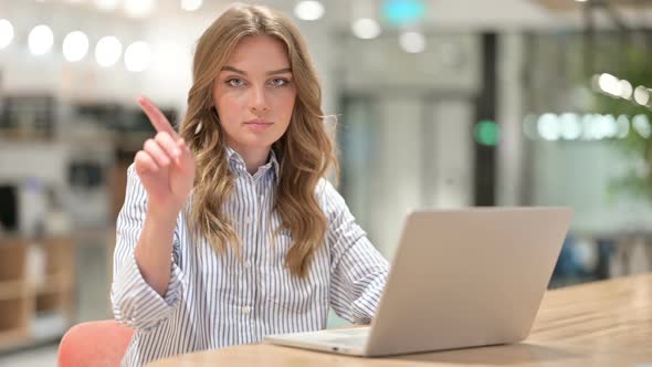 Businesswoman with Laptop Showing No Sign