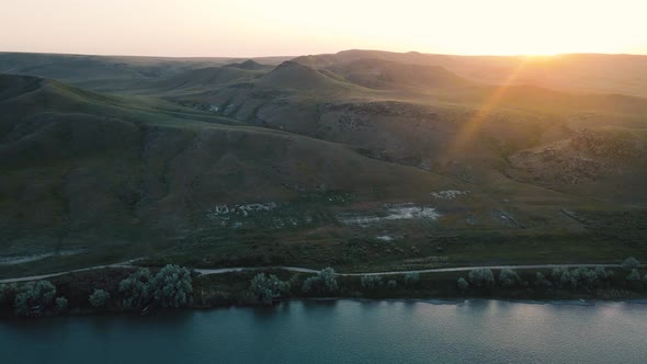 Drone Shot of River and Mountains at Sunset in Kazakhstan