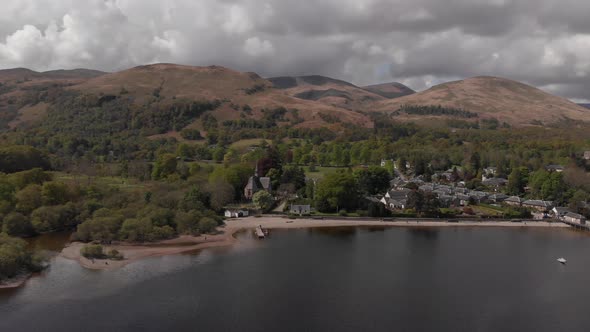 Luss Village, Loch Lomond, Jetty Sandy Beach The Trossachs, Highlands, Scotland Spring Aerial D Log