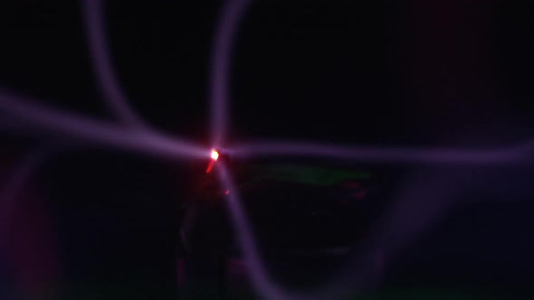 Lasers of plasma ball moving in slow motion