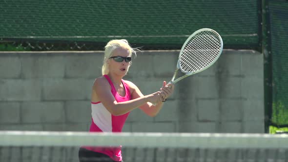 Women playing tennis.
