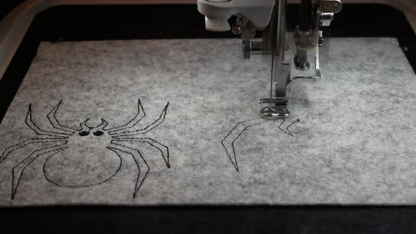 Machine embroidery, creation of the decoration for the Halloween Festival
