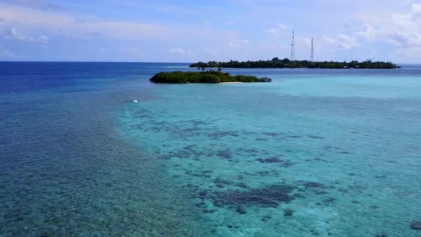 Aerial scenery of coast beach by lagoon and sand background