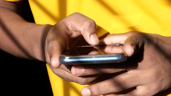 Young Man Using Smart Phone Close Up 